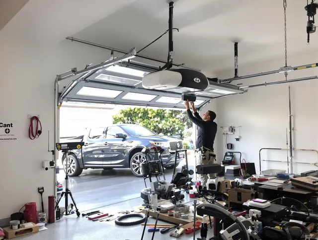 Strongsville Garage Door Repair specialist installing smart garage door opener system in Strongsville home