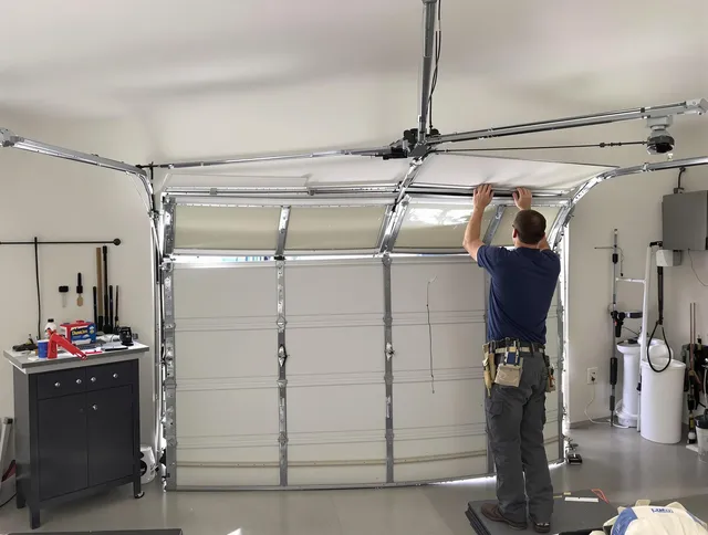 Strongsville Garage Door Repair specialist performing precise section replacement on Strongsville garage door